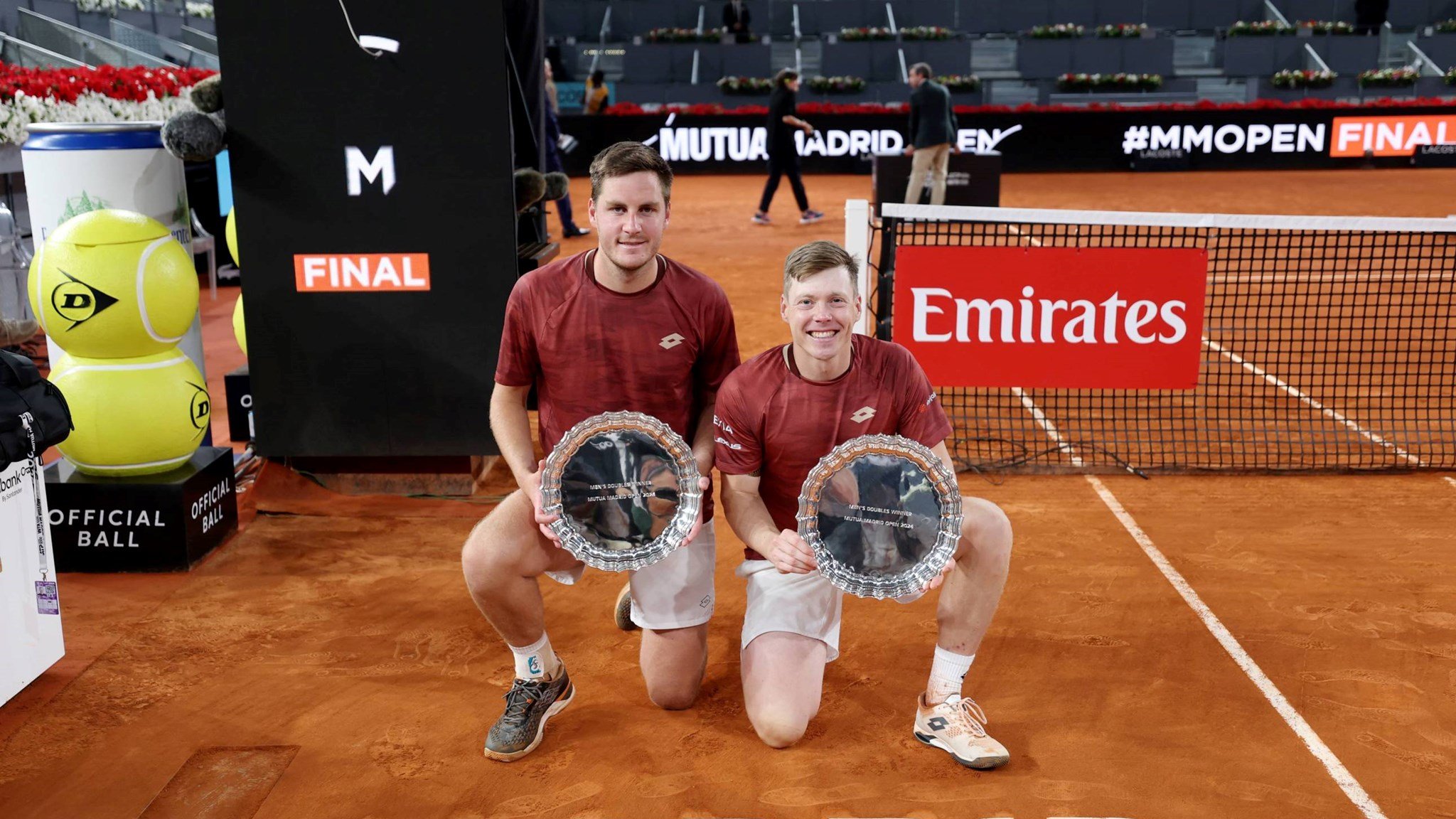 Henry Patten and Harri Heliovaara holding the Mutua Madrid Open title