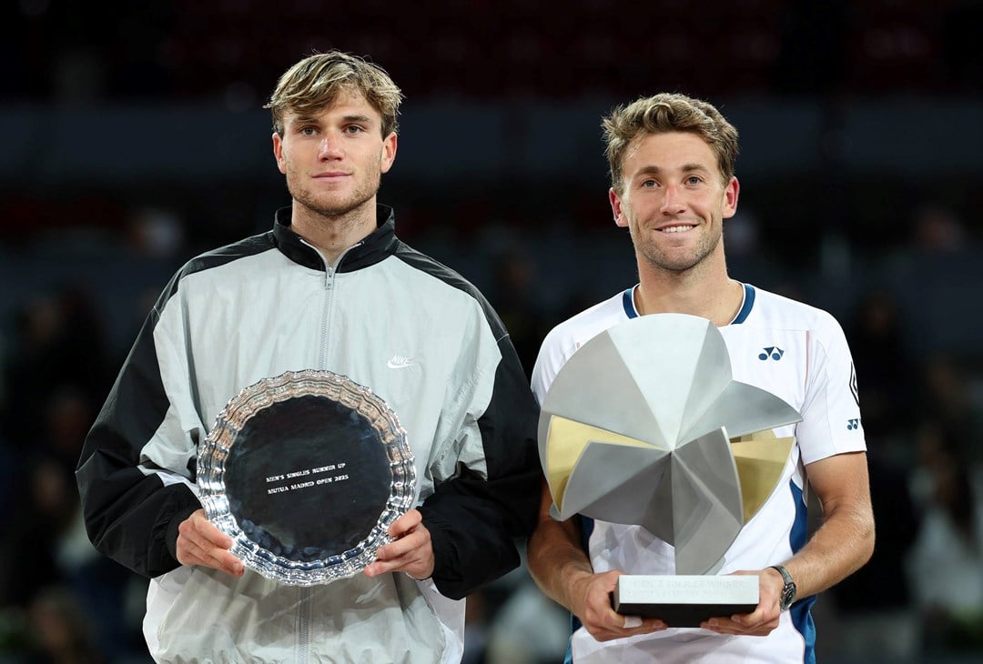 Jack Draper and Casper Ruud holding their Mutua Madrid Open trophies after Ruud beat Draper 7-5, 3-6, 6-4 in the final