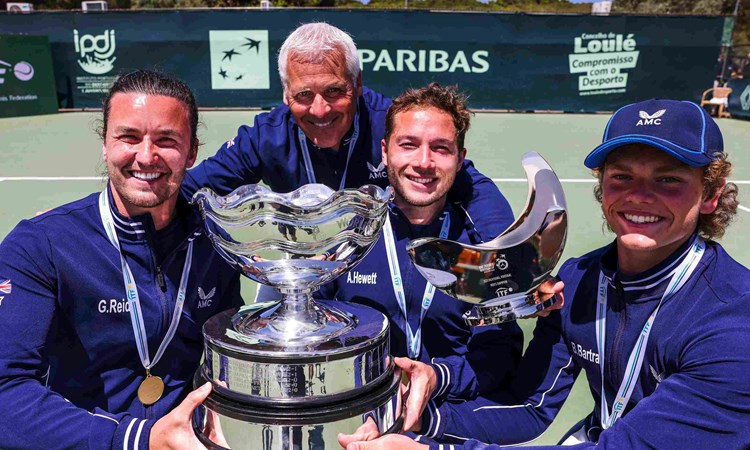 Gordon Reid, Alfie Hewett and Ben Bartram holding the championship trophy on court at the World Team Cup