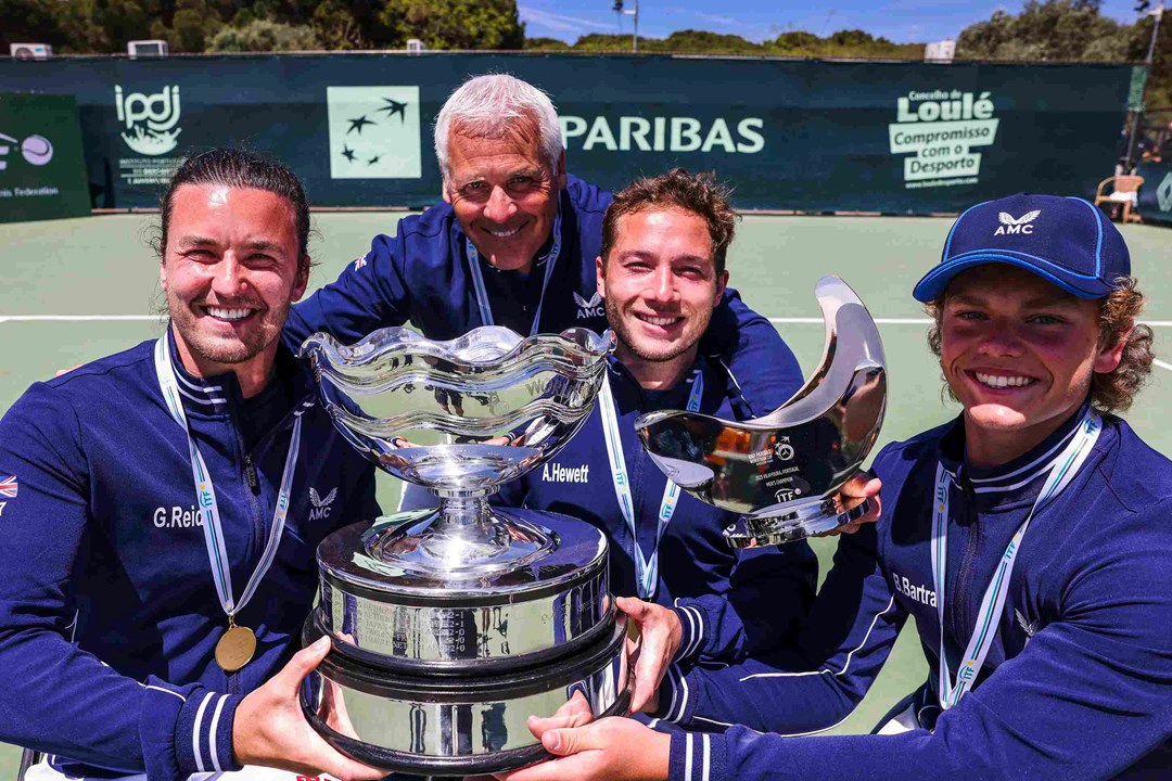 Gordon Reid, Alfie Hewett and Ben Bartram holding the championship trophy on court at the World Team Cup