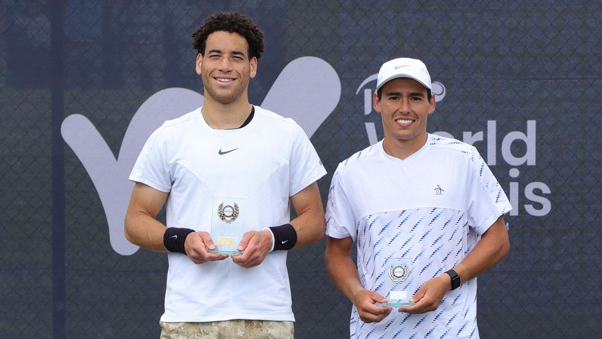 George Loffhagen holding his winners trophy at the Lexus Pro Series Nottingham alongside runner-up Charles Broom