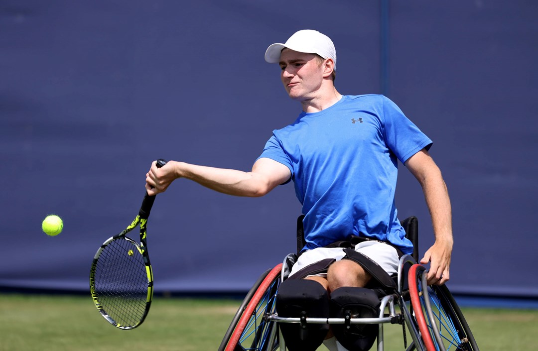 Andrew Penney hits a forehand in the wheelchair exhibition at The Queen's Club in 2024