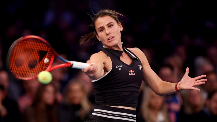 American Emma Navarro connects on a forehand during a tennis match