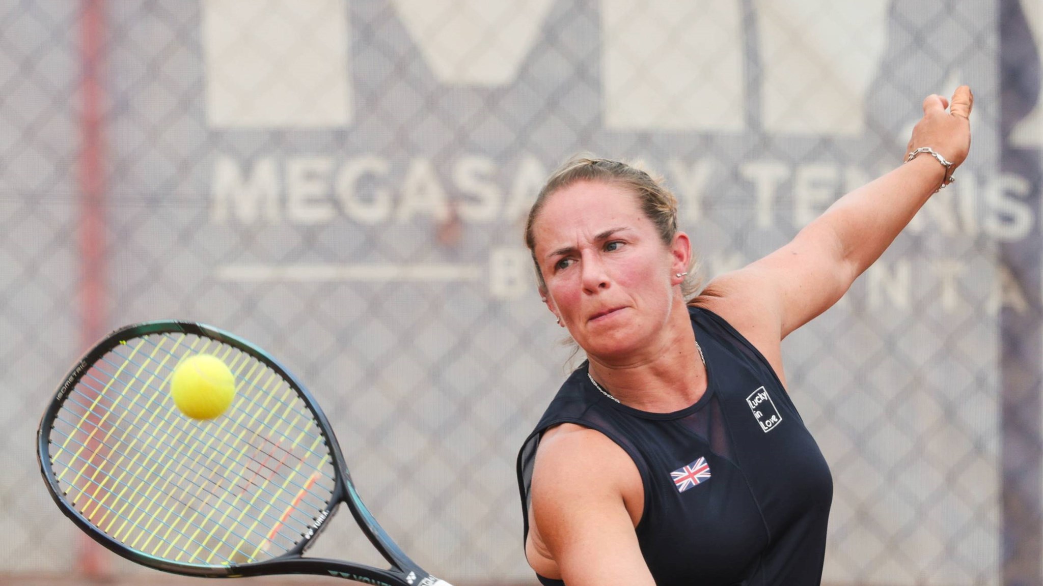 Lucy Shuker reaches for a volley playing for GB at the World Team Cup 2024