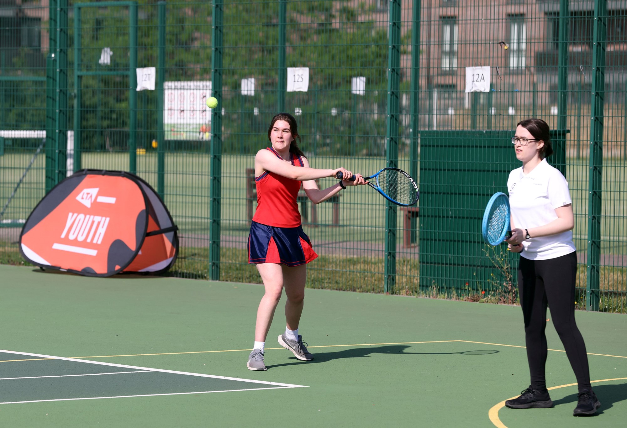 Students on court during the LTA Youth Session with St Paul's Way School