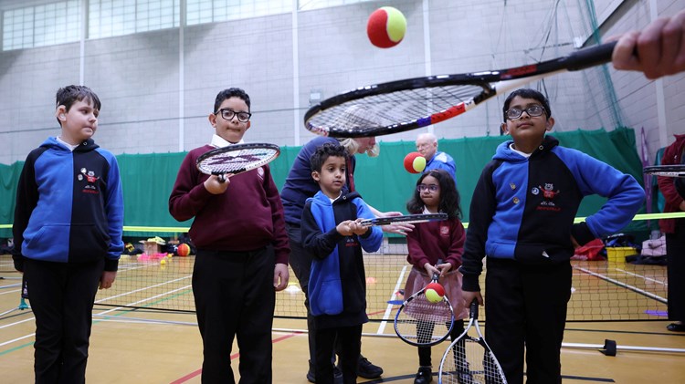 Group of kids playing at a Deaf Tennis Festival