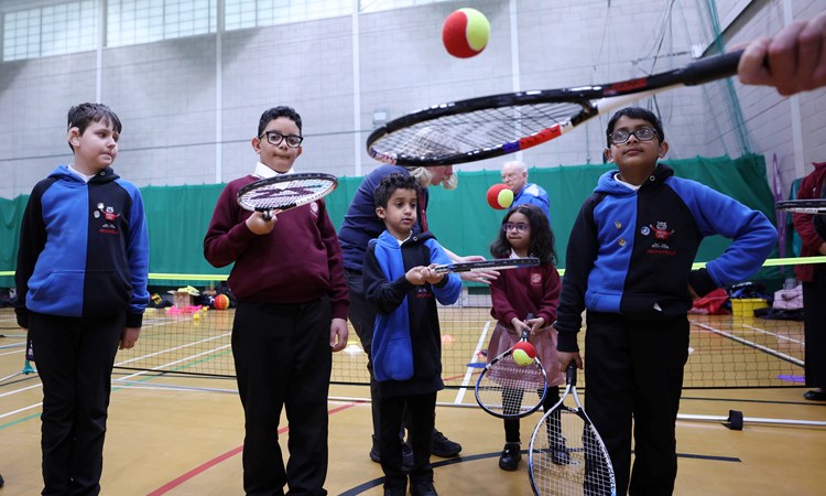 Group of kids playing at a Deaf Tennis Festival