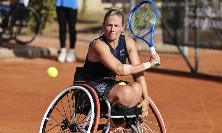 Lucy Shuker hitting a backhand at the World Team Cup