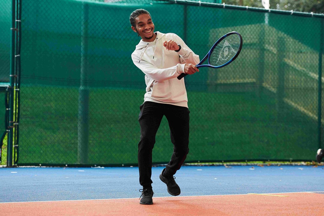 A male tennis player on court at the National Tennis Centre for the Tennis Black List event