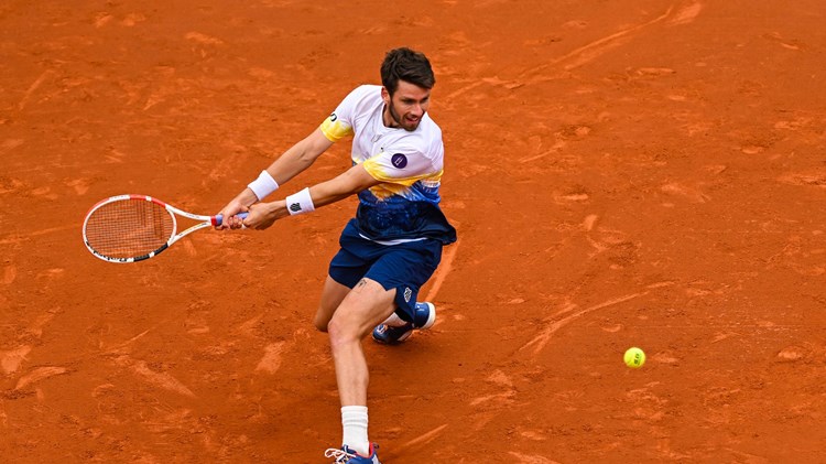 Cam Norrie sliding into a backhand at the Barcelona Open