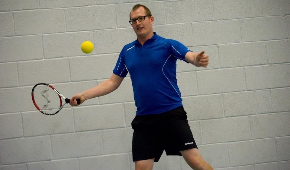 Ian Pearson-Brown with a forehand return during a tennis match