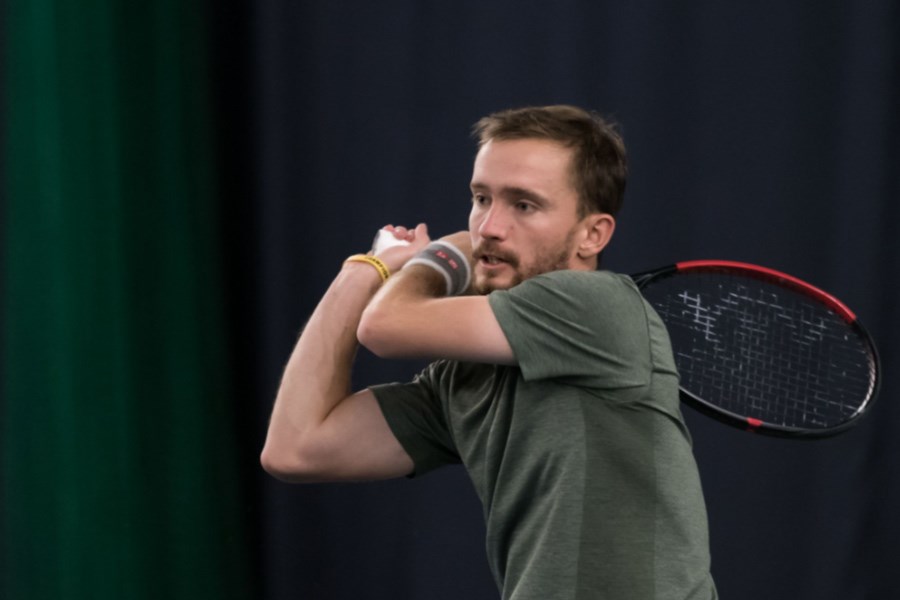 joe gill on court in tennis match