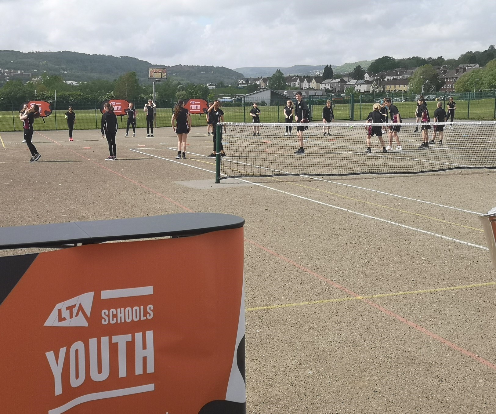 Students at Cardinal Newman Catholic School participating in an LTA Youth coaching session