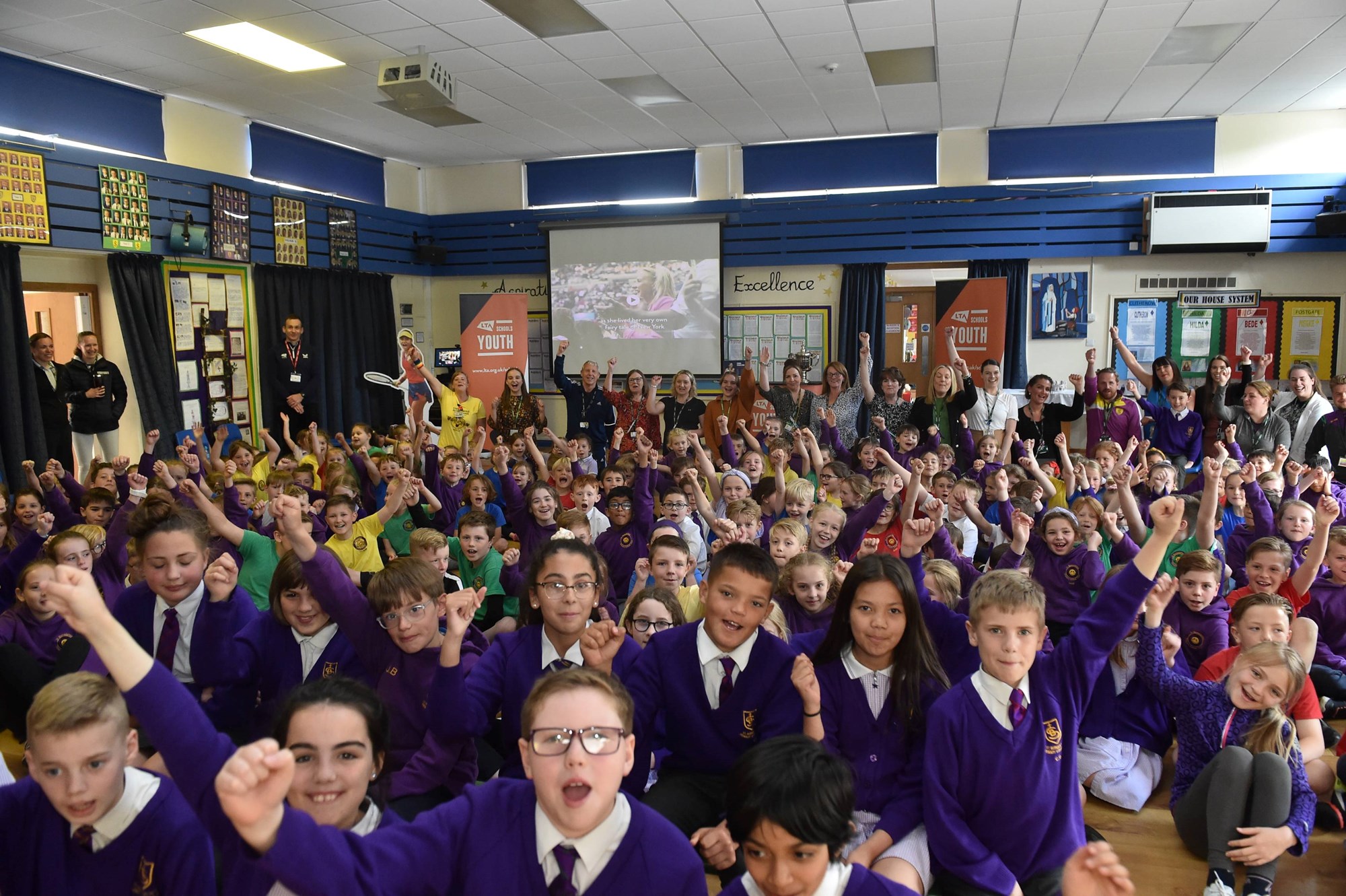 Students at St. Bernadettes Primary School cheering as Emma Raducanu's US Open Trophy arrives