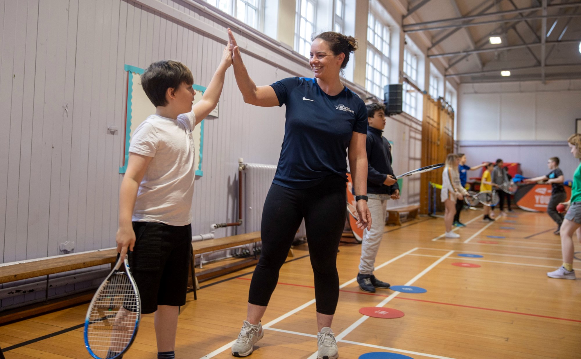 Pupils from Broughton Primary School participating in a LTA Youth coaching session during Emma Raducanu's US Open Trophy Tour