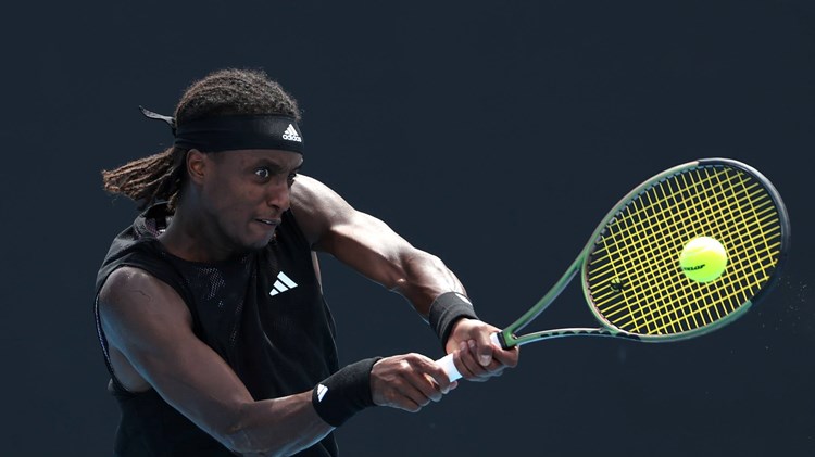 Mikael Ymer hitting a backhand at the Australian Open 