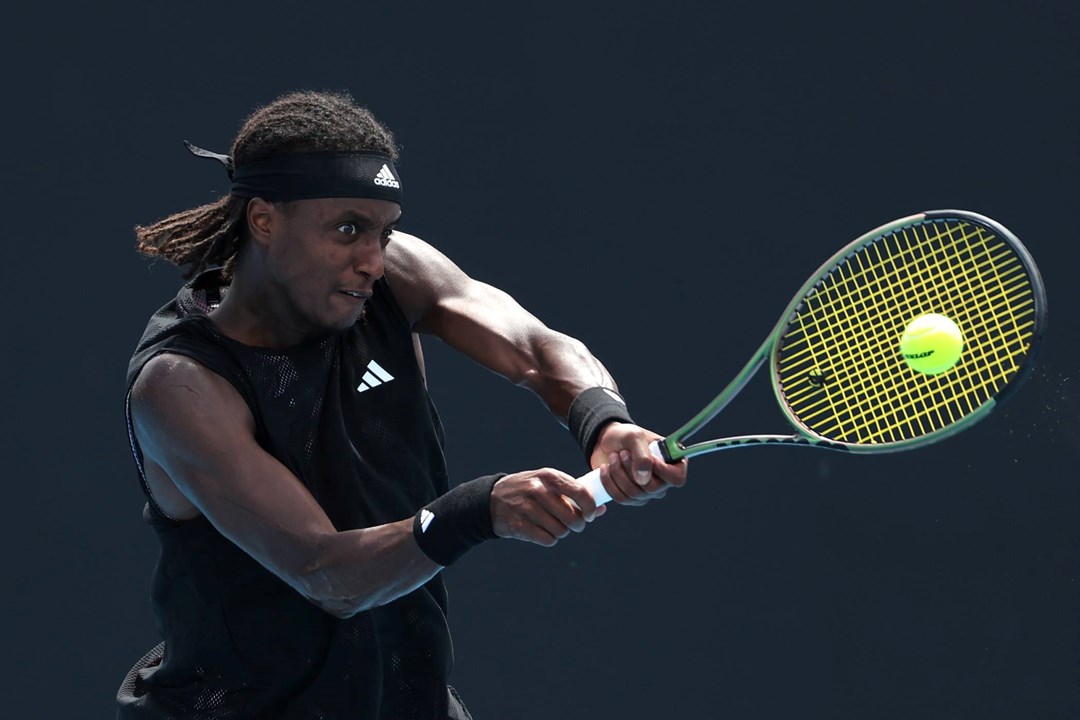 Mikael Ymer hitting a backhand at the Australian Open 