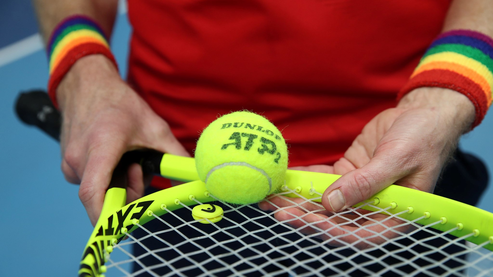 Tennis player wearing Pride wristbands