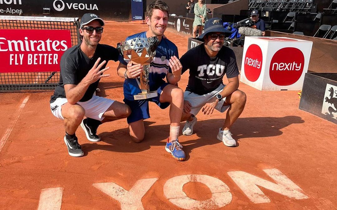 Cam Norrie poses with his fourth ATP title in Lyon