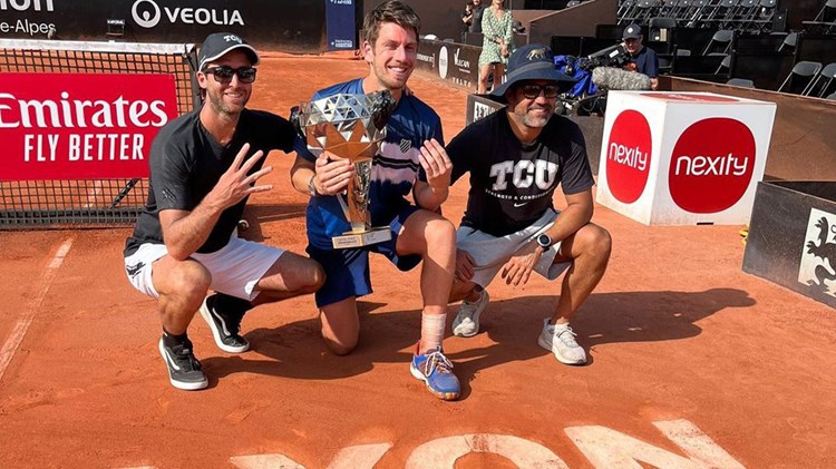 Cam Norrie poses with his fourth ATP title in Lyon