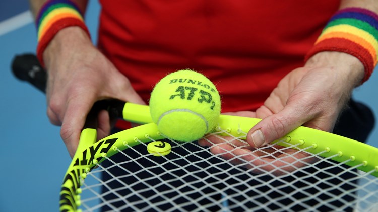 Tennis player wearing Pride wristbands