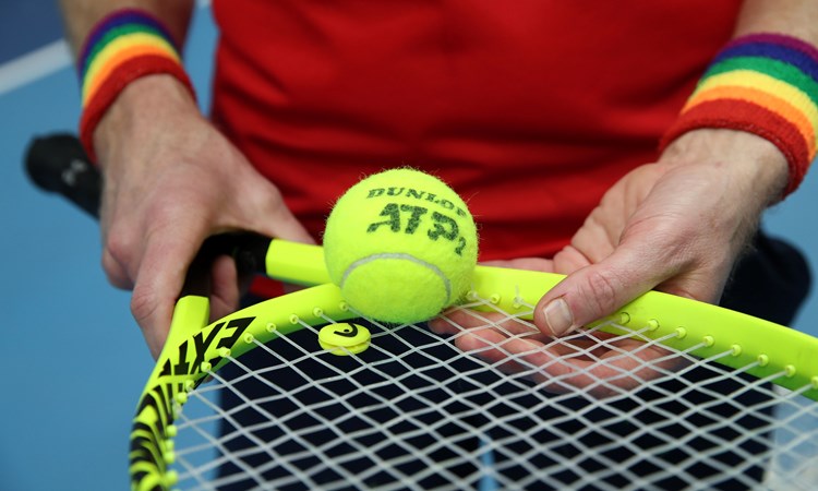 Tennis player wearing Pride wristbands