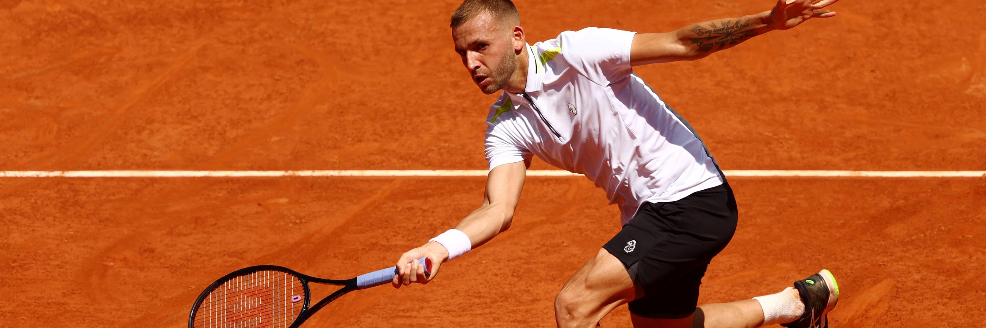Dan Evans plays a volley at the Mutua Madrid Open