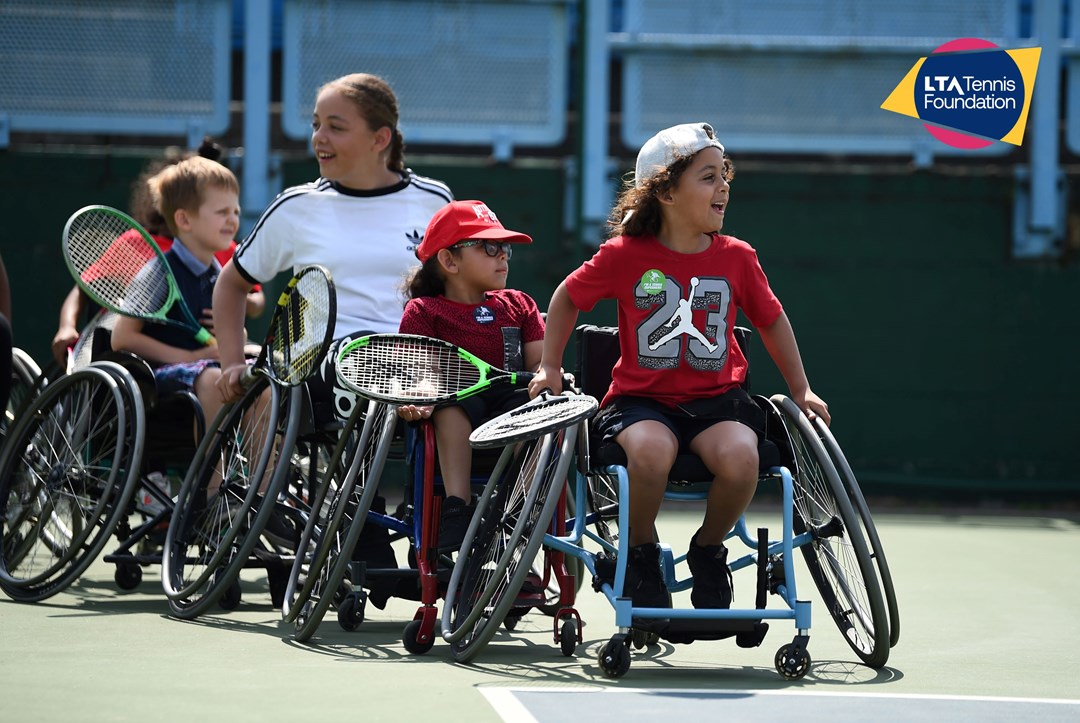 Young wheelchair tennis players heading onto court