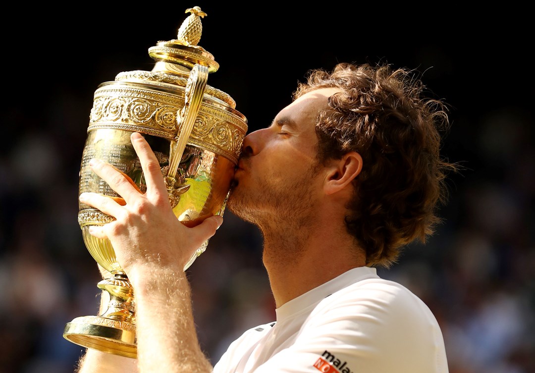 Andy Murray kisses the trophy after being crowned Wimbledon champion for the second time in his career