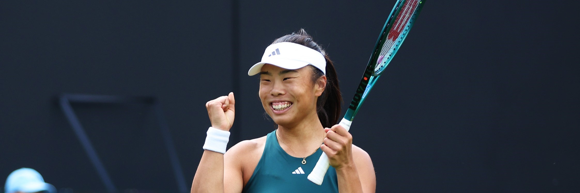 Mimi Xu smiles in celebration after a win at the Lexus Birmingham Open