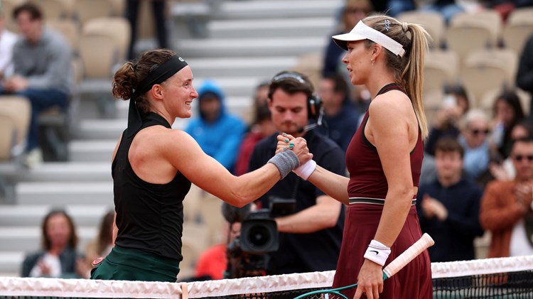 Carole Monnet and Katie Boulter shake hands at the net after the first round of Roland Garros