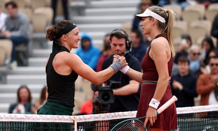 Carole Monnet and Katie Boulter shake hands at the net after the first round of Roland Garros