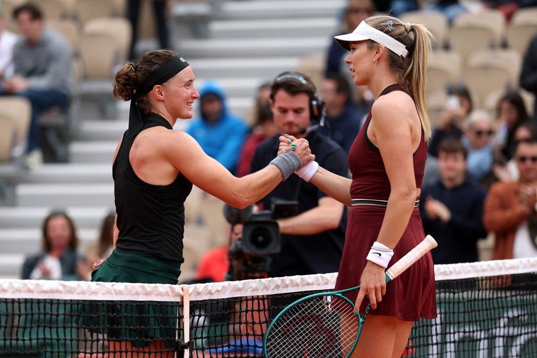 Carole Monnet and Katie Boulter shake hands at the net after the first round of Roland Garros