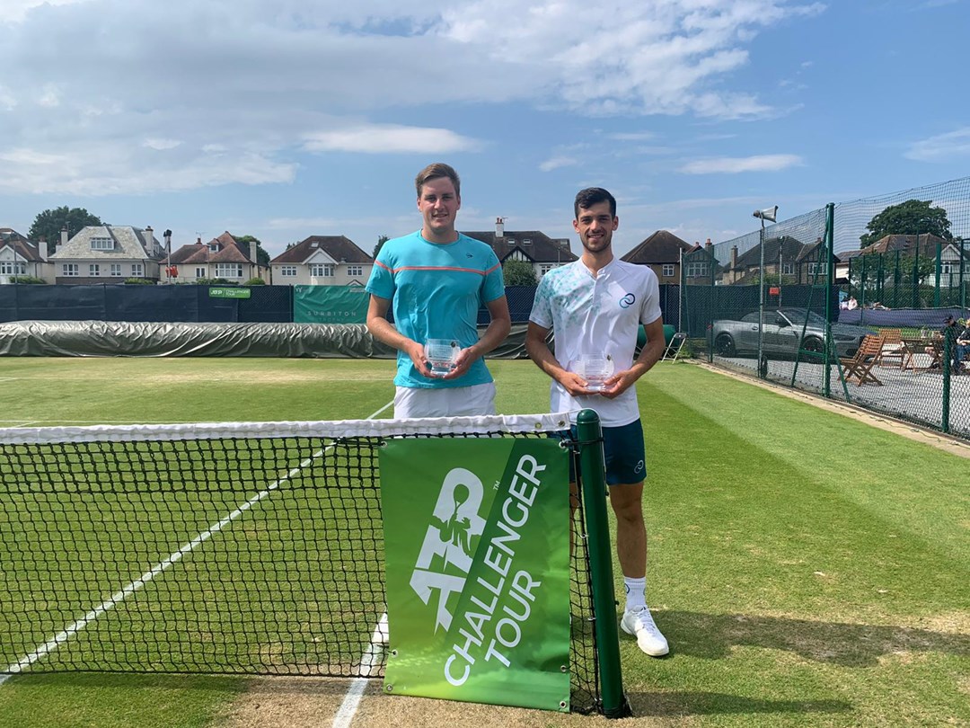 Julian Cash and Henry Patten holding the 2022 Surbiton Trophy doubles trophy