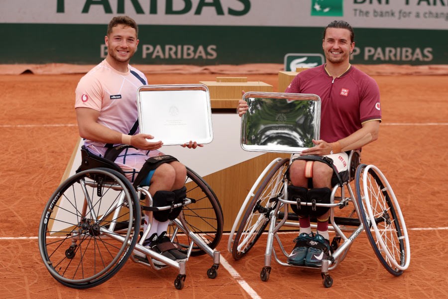 tennis scotland roland garros two players on clay court receiving awards