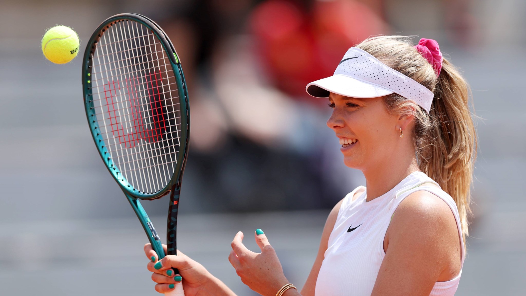 Katie Boulter smiles on the practice court at Roland Garros