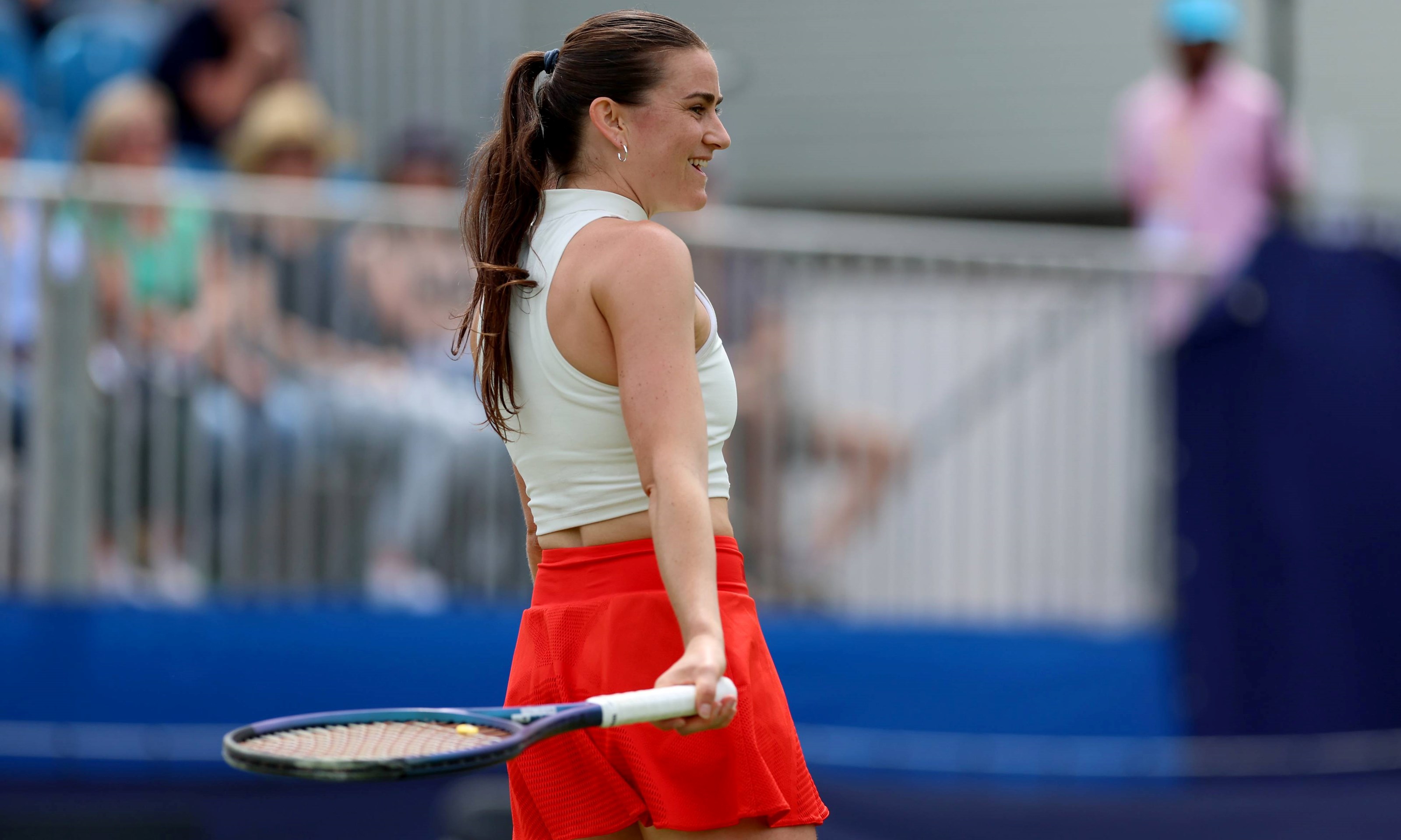 Katy Dunne smiles on court at the Lexus Surbiton Trophy