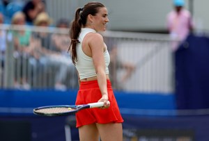 Katy Dunne smiles on court at the Lexus Surbiton Trophy