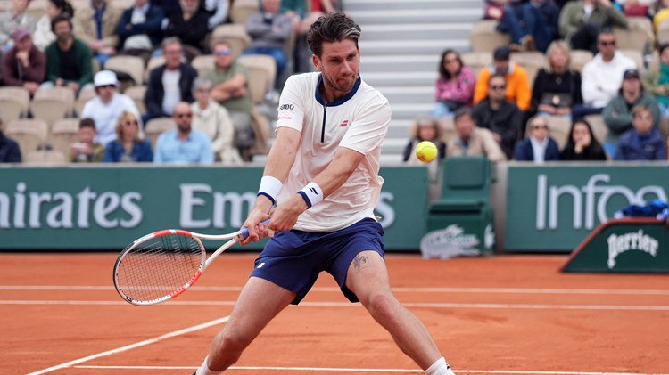 Cam Norrie hits a backhand against Daniil Medvedev in the opening round at Roland Garros
