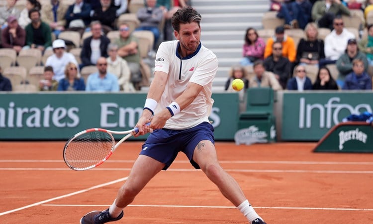 Cam Norrie hits a backhand against Daniil Medvedev in the opening round at Roland Garros