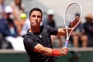 Joe Salisbury plays a backhand during his second round match of the men's doubles at the 2023 Roland Garros.
