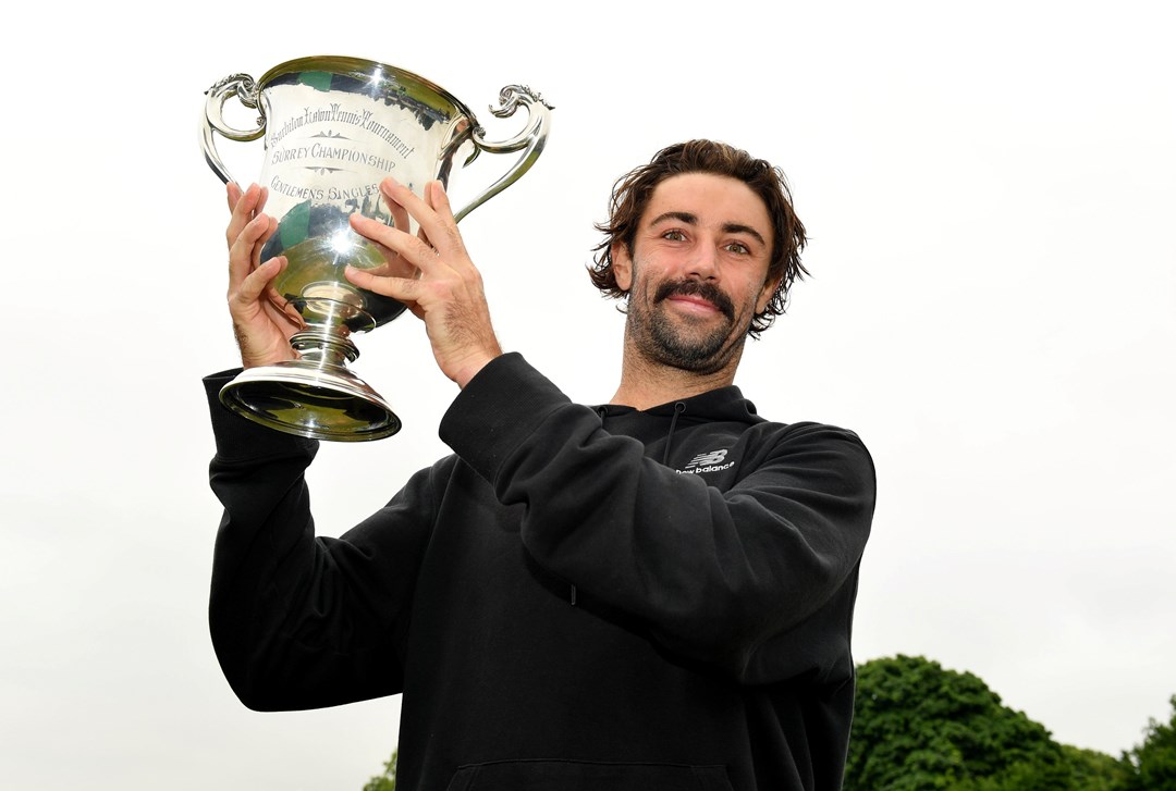 Jordan Thompson holding the Surbiton Trophy