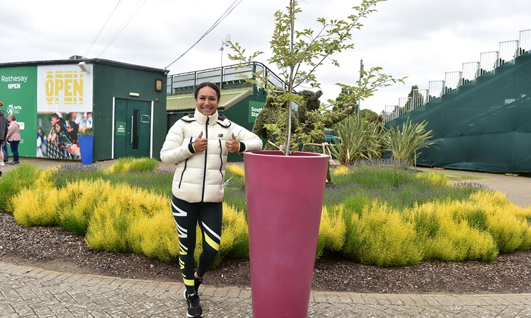 Heather Watson poses next to the cherry blossom tree she helped the LTA plant at Nottingham Tennis Centre to mark the Platinum Jubilee