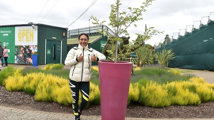Heather Watson poses next to the cherry blossom tree she helped the LTA plant at Nottingham Tennis Centre to mark the Platinum Jubilee