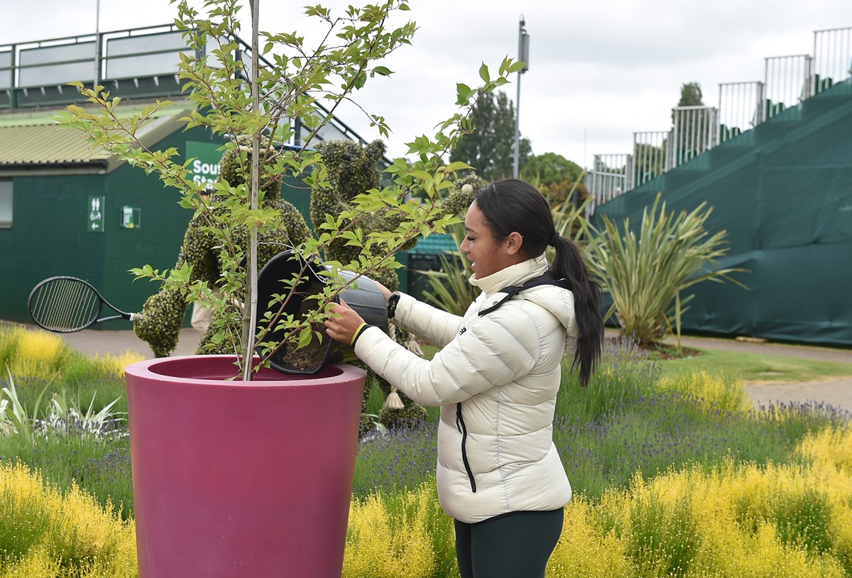 Heather Watson planting a tree at the LTA's Nottingham Tennis Centre to mark The Queen's Platinum Jubilee