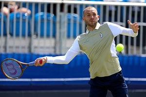 Dan Evans preparing to hit a forehand on court at the Lexus Surbiton Trophy