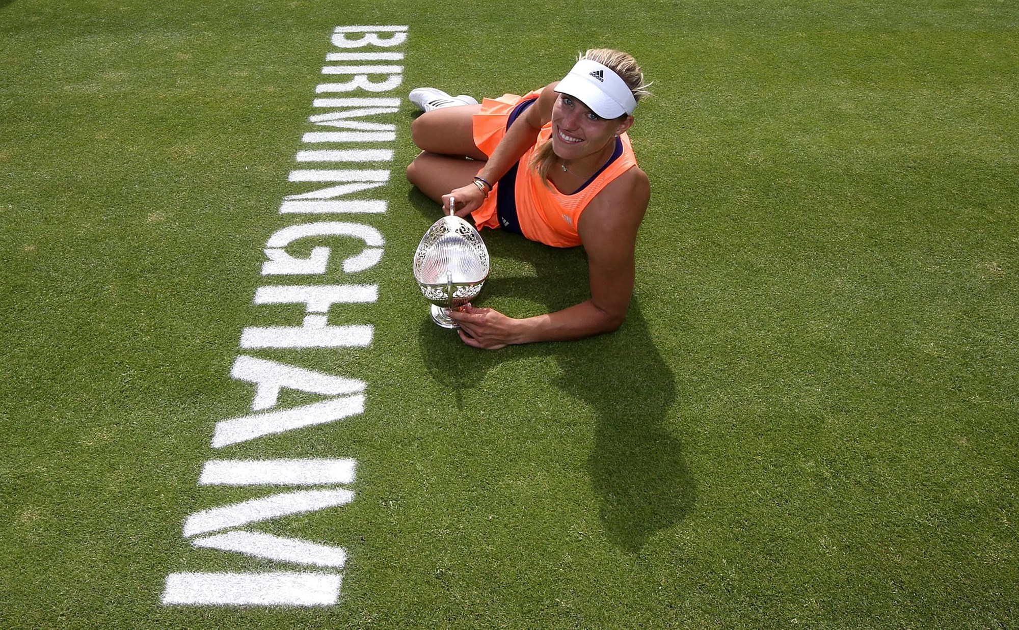 Angelique Kerber poses with the trophy after winning her singles final match in 2015