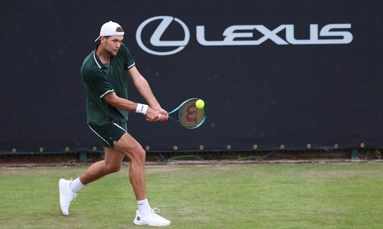 Otto Virtanen hitting a backhand at the Lexus Birmingham Open