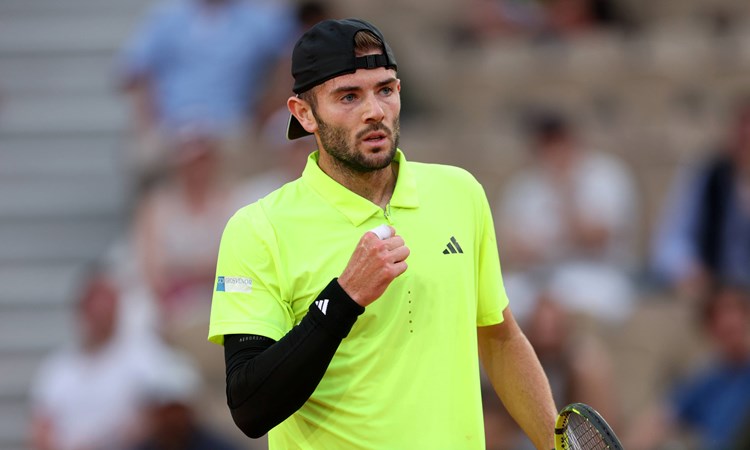Jacob Fearnley pumps his fist in celebration during his second round match at Roland Garros