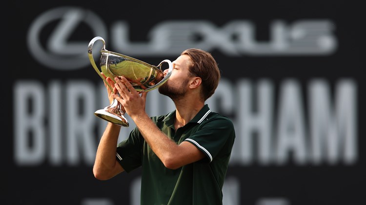 Otto Virtanen kisses the trophy after winning the Lexus Birmingham Open